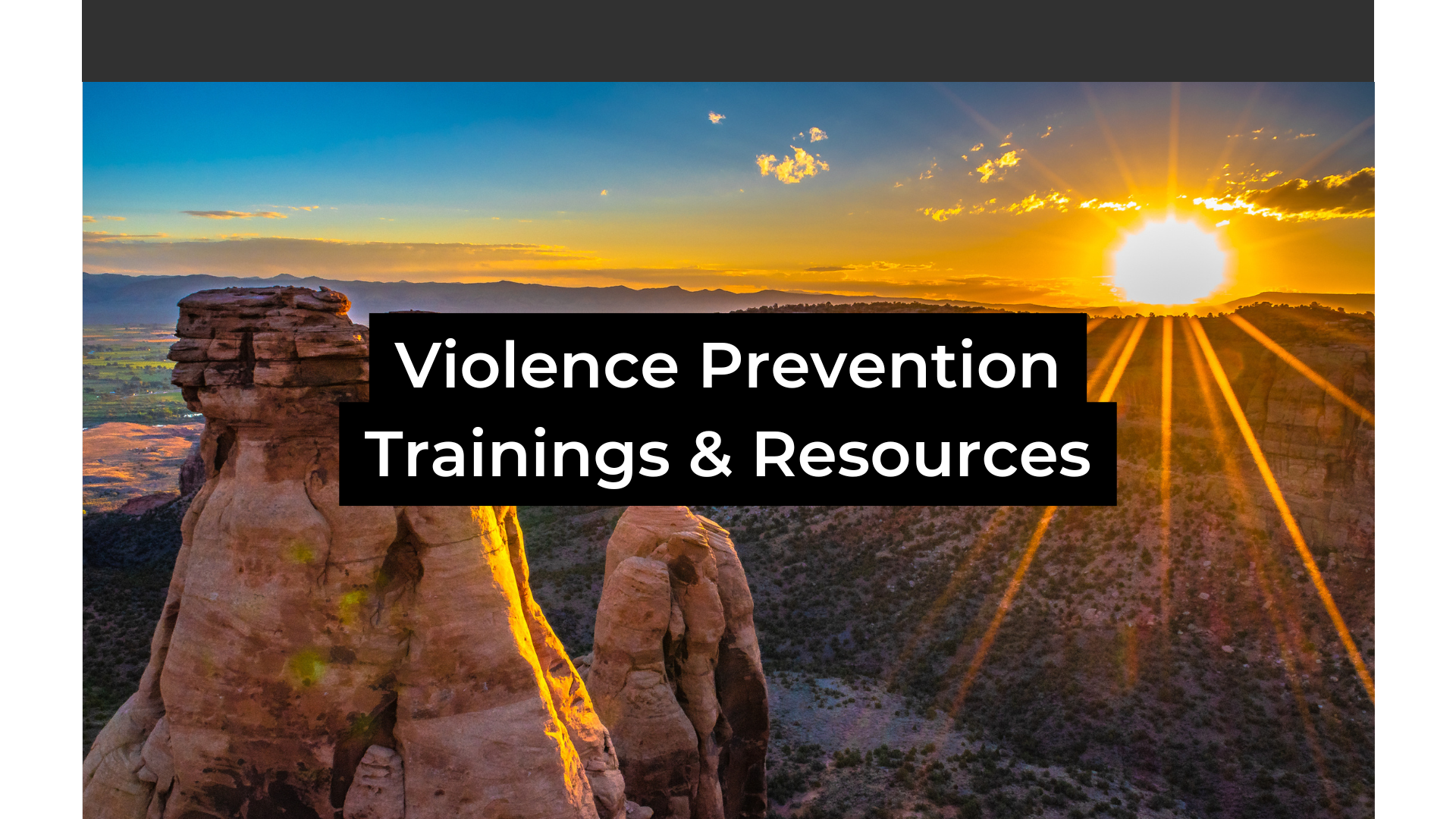 Colorado National Monument in the background at sunrise with the words Violence Prevention Trainings & Resources